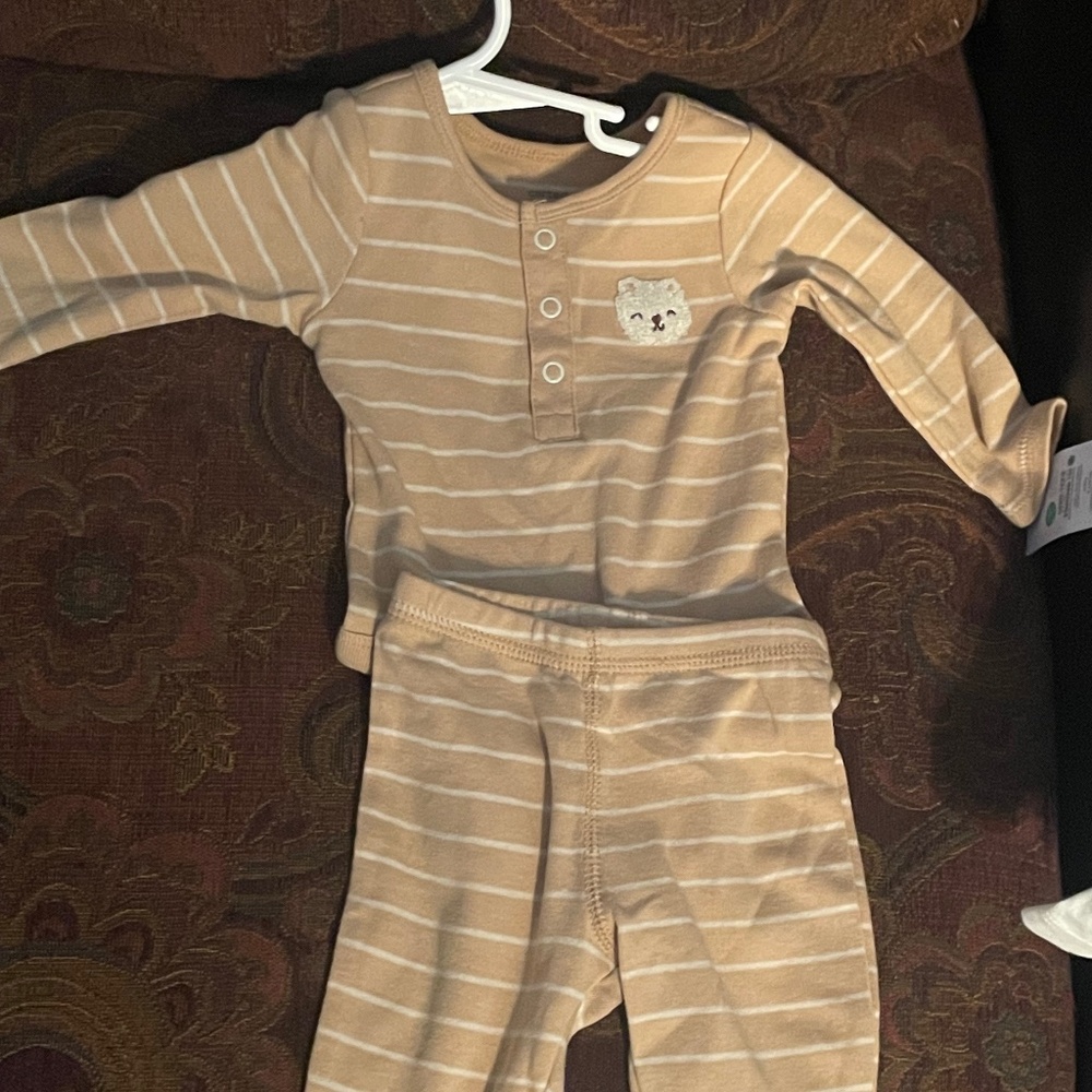 Brand new, never used. Includes a soft, long-sleeve top and matching bottom.R